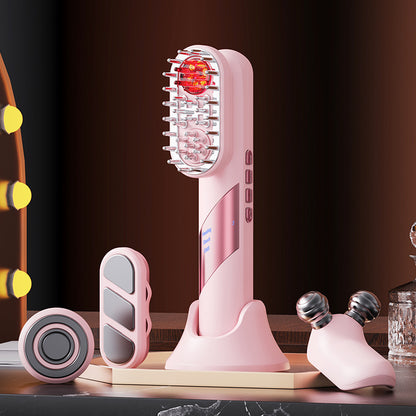 Pink Massager with multiple replaceable heads on a dark background