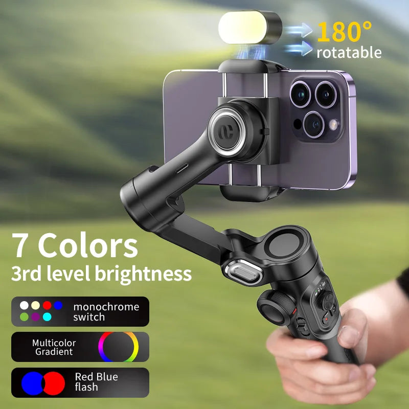 Handheld camera stabilizer with smartphone mount and light, held by a person, with a green blurred background.