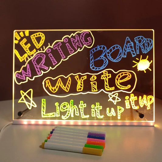 LED writing board with colorful markers on a dark background