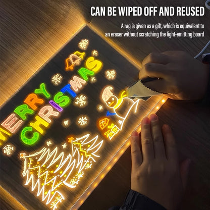 Light-up Christmas-themed board with colorful text and graphics, being wiped off with a rag.