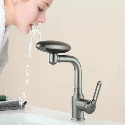 Person drinking water from a faucet with a beige background