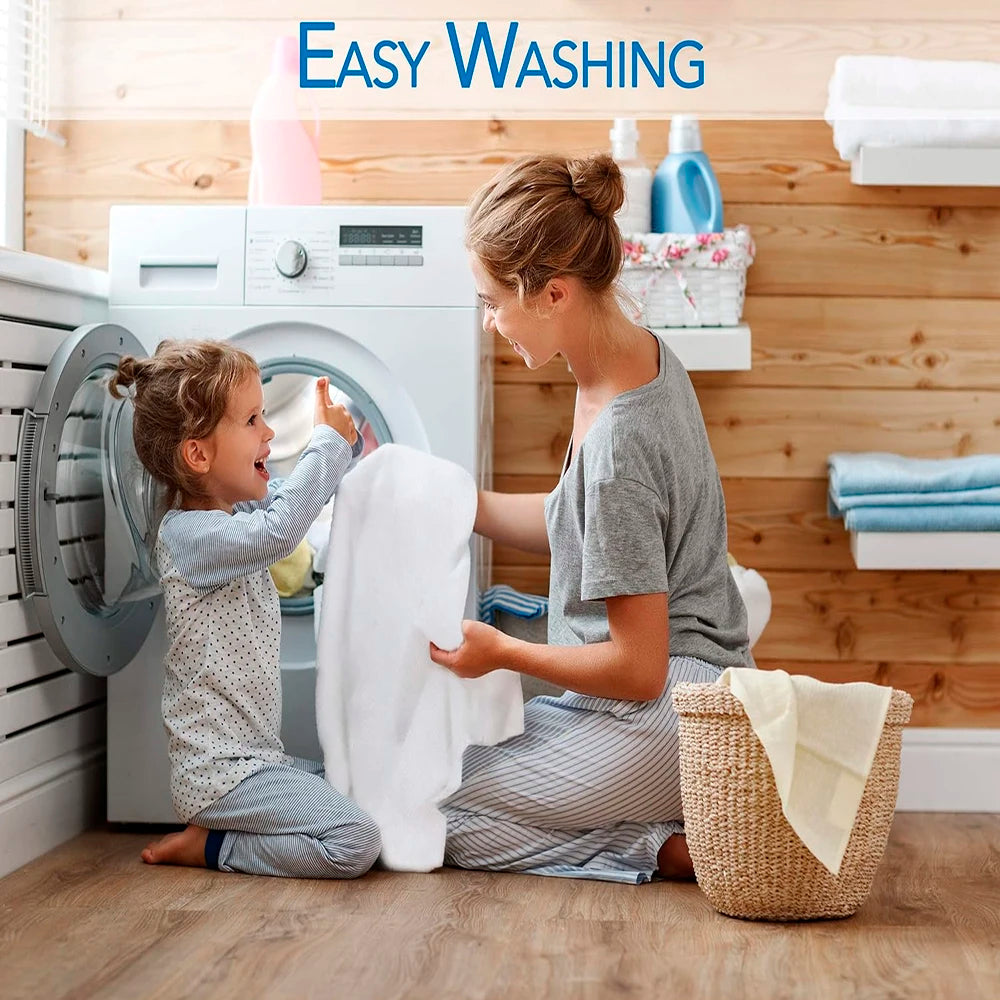 Woman and child interacting with a washing machine in a laundry room.